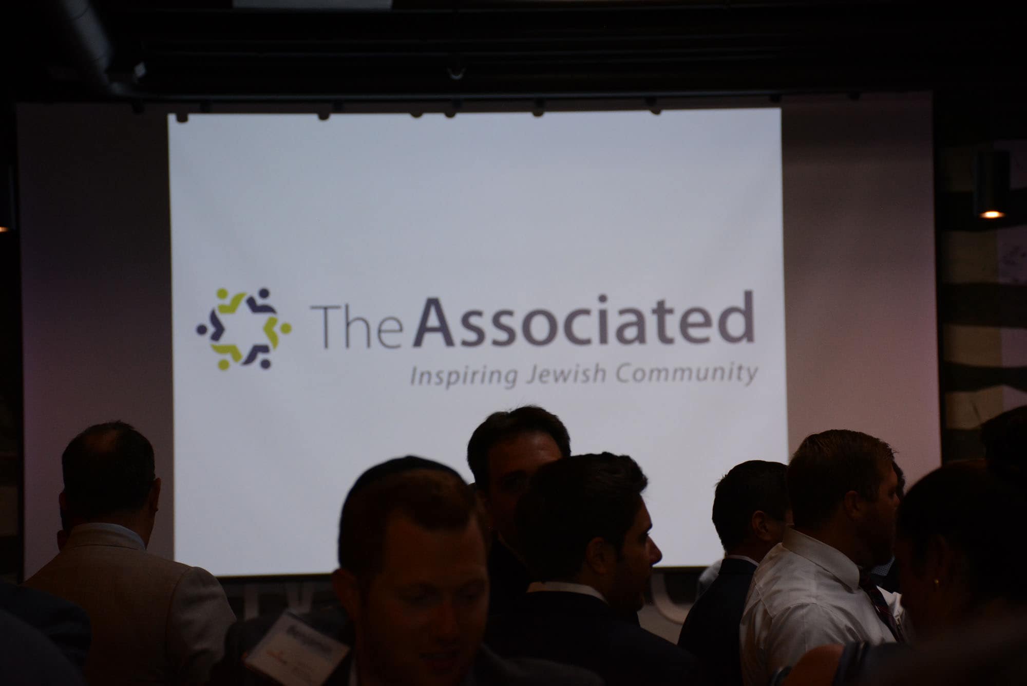 Dozens of folks mingled at the REIG Annual Event before hearing the evening's guest speaker, Marc Weller, Sagamore Development president.