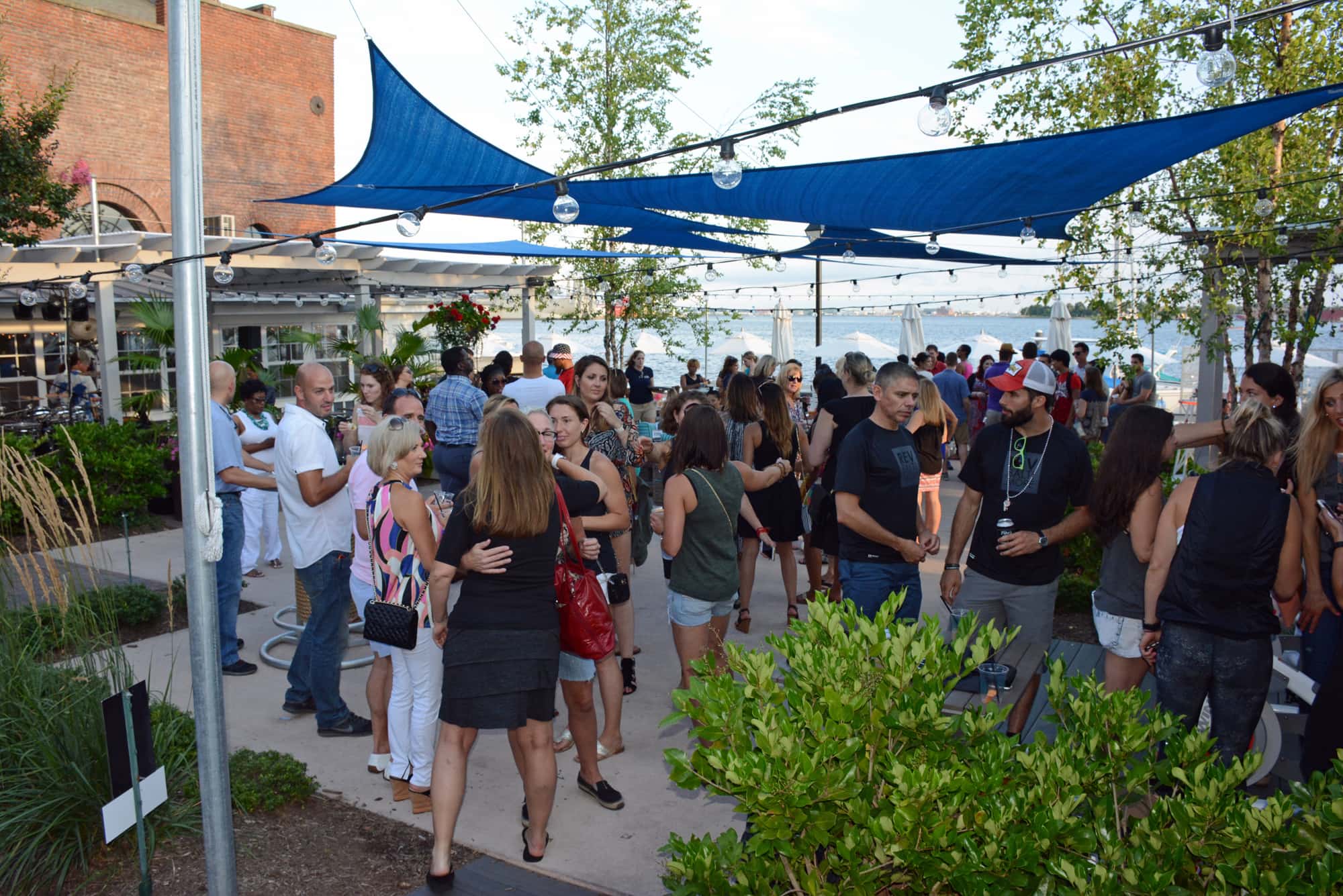 Guests mixed and mingled on The Boathouse Canton outdoor patio