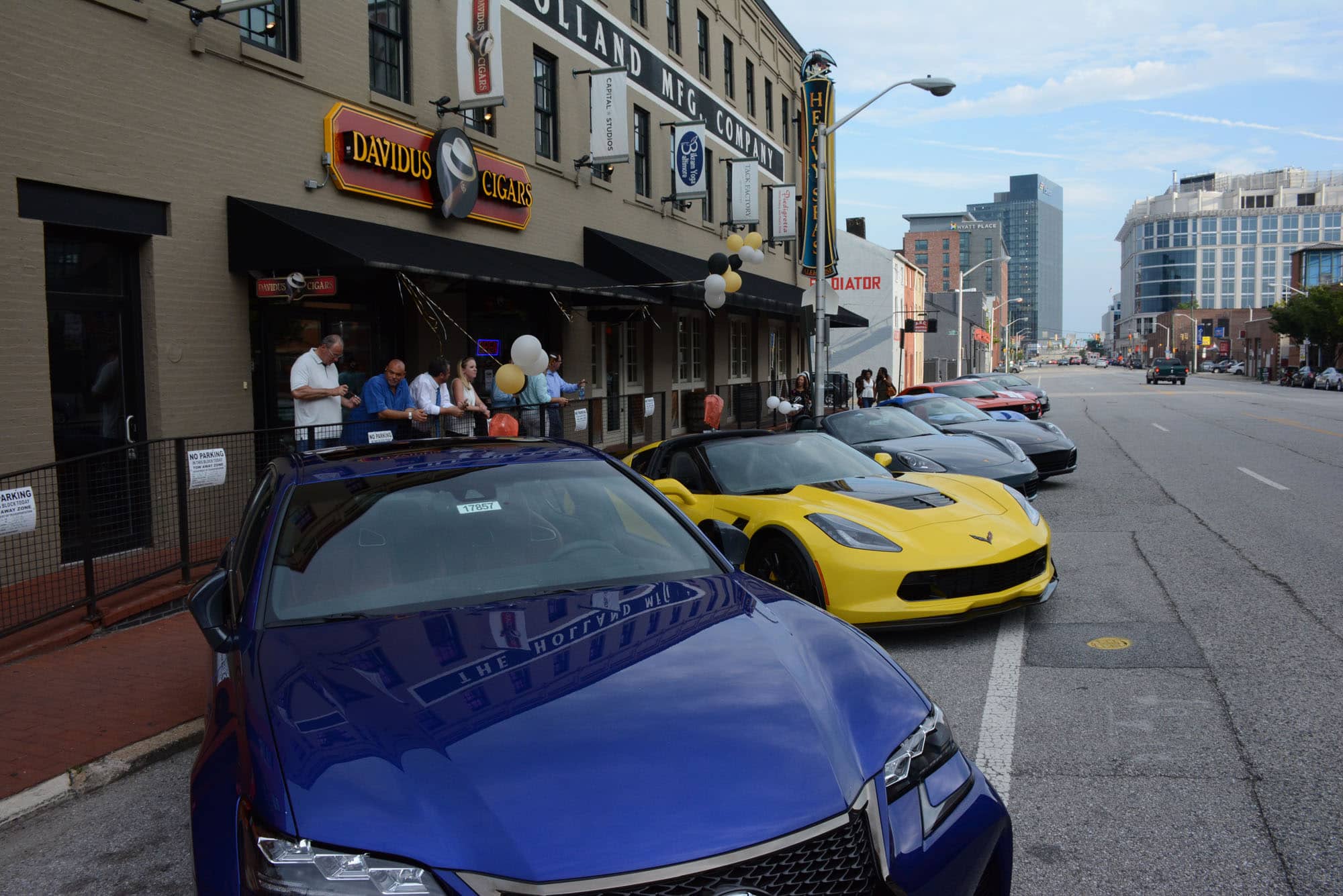 The lux auto show outside Davidus Cigars.
