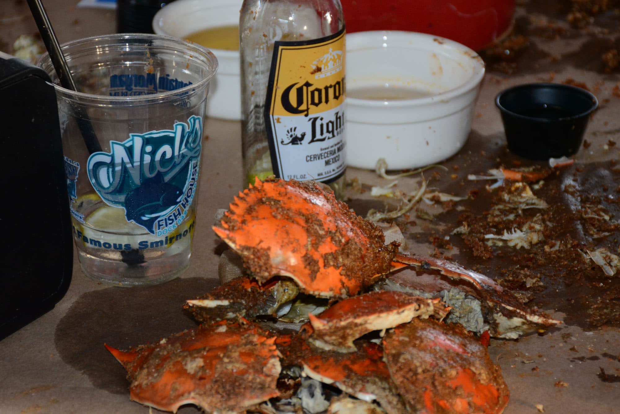 Signs of success; almost empty drinks and piles of crab shells.