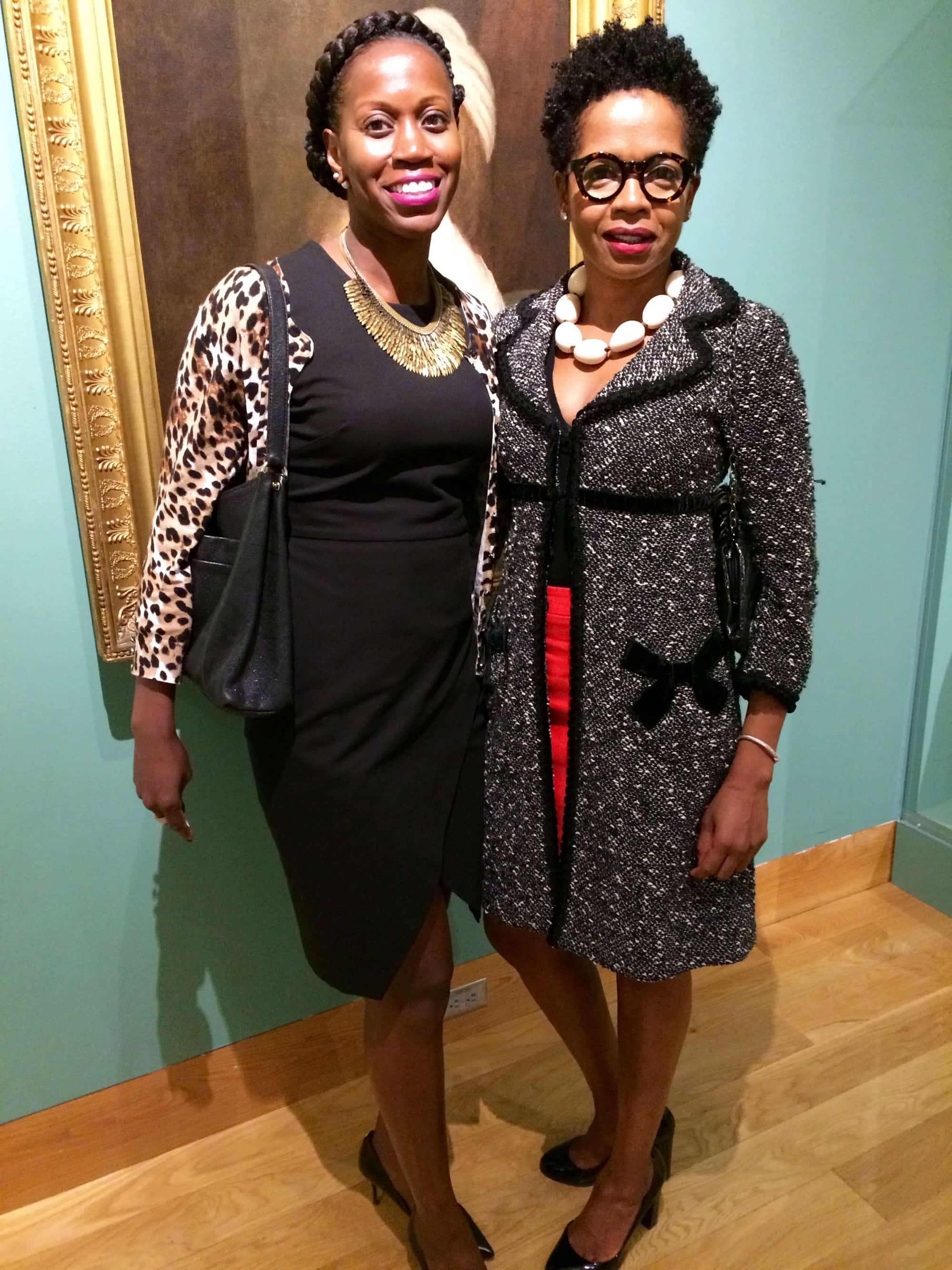 Kendra Parlock, from the Mt. Royal Improvement Association (left), in a Banana Republic black dress with a leopard print cardigan and Pegasus necklace from Stella & Dot, and Dahlia Woody, IT professional, in a black marled coat by Nanette Lepore from Redeux in Roland Park, an orange Pencil Skirt by J. Crew and tortoiseshell-frame glasses by pLAtOy