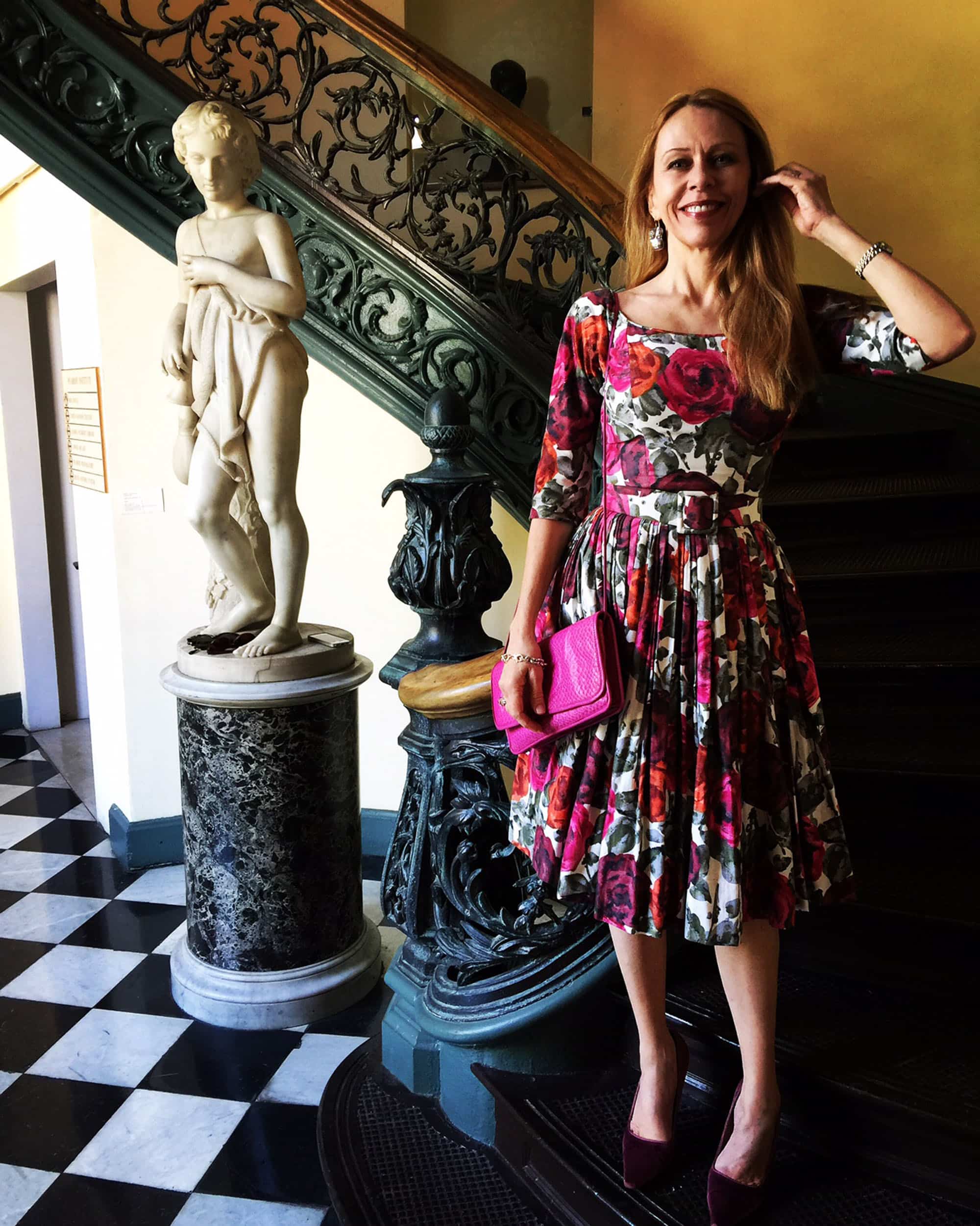 Visiting friends in town from her home in Florida was Deborah Newell Tornello, a vintage fiend if ever there were one. On this day she was wearing a classic 1950s floral-print by Suzy Perette (the Perette company had exclusive rights to recreate for a middle-class clientele the designs of Christian Dior between 1947 and 1957), with mauve velvet Gucci pumps, a fuchsia clutch by Carlos Falchi, and hammered silver earrings and bracelet by Evander Preston of St. Petersburg, Florida. I think she cuts an appropriately elegant figure on the famous spiral staircase of the Peabody Library.