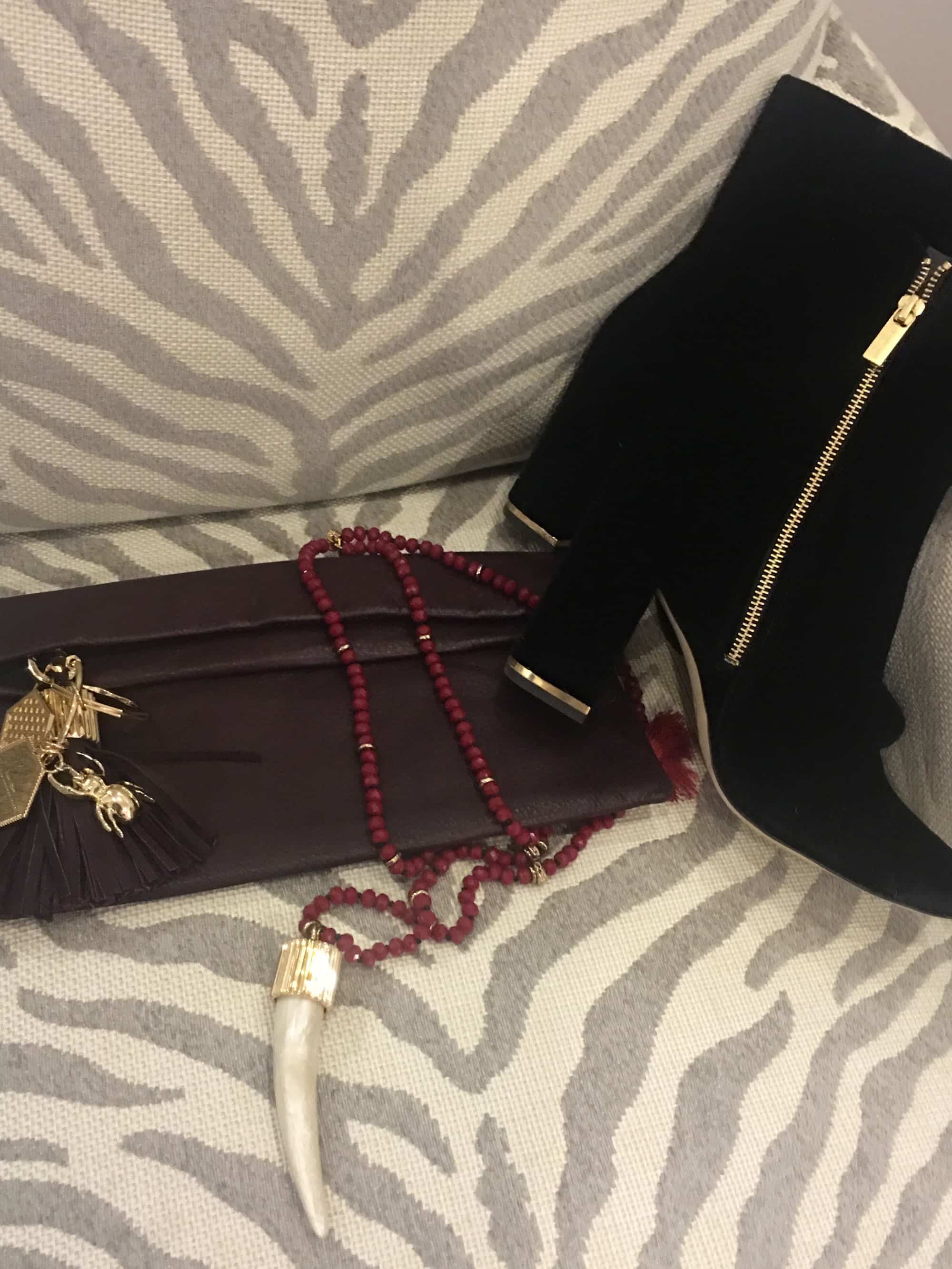 ...Disco Volante chandelier earrings, and a maroon spirit necklace all from designer India Hicks.
