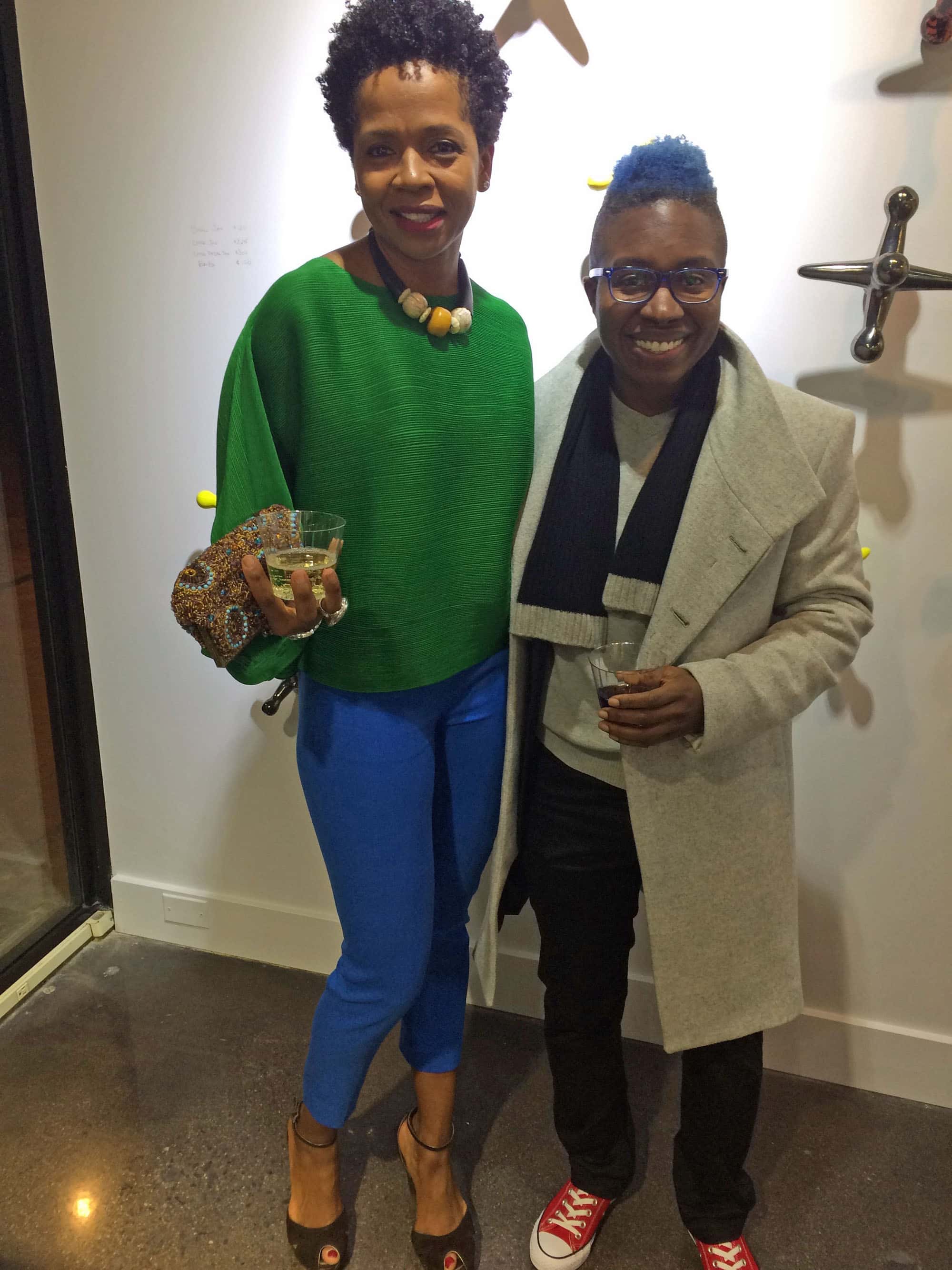 Also in attendance were Dahlia Woody and her partner Q Ragsdale. Dahlia said she couldn’t remember where she got her vivid green-and-blue ensemble. But there was no mistaking who made Q’s classic red low-top Chuck Taylors – Converse. Q’s sculptural wool felt coat is from Zara.